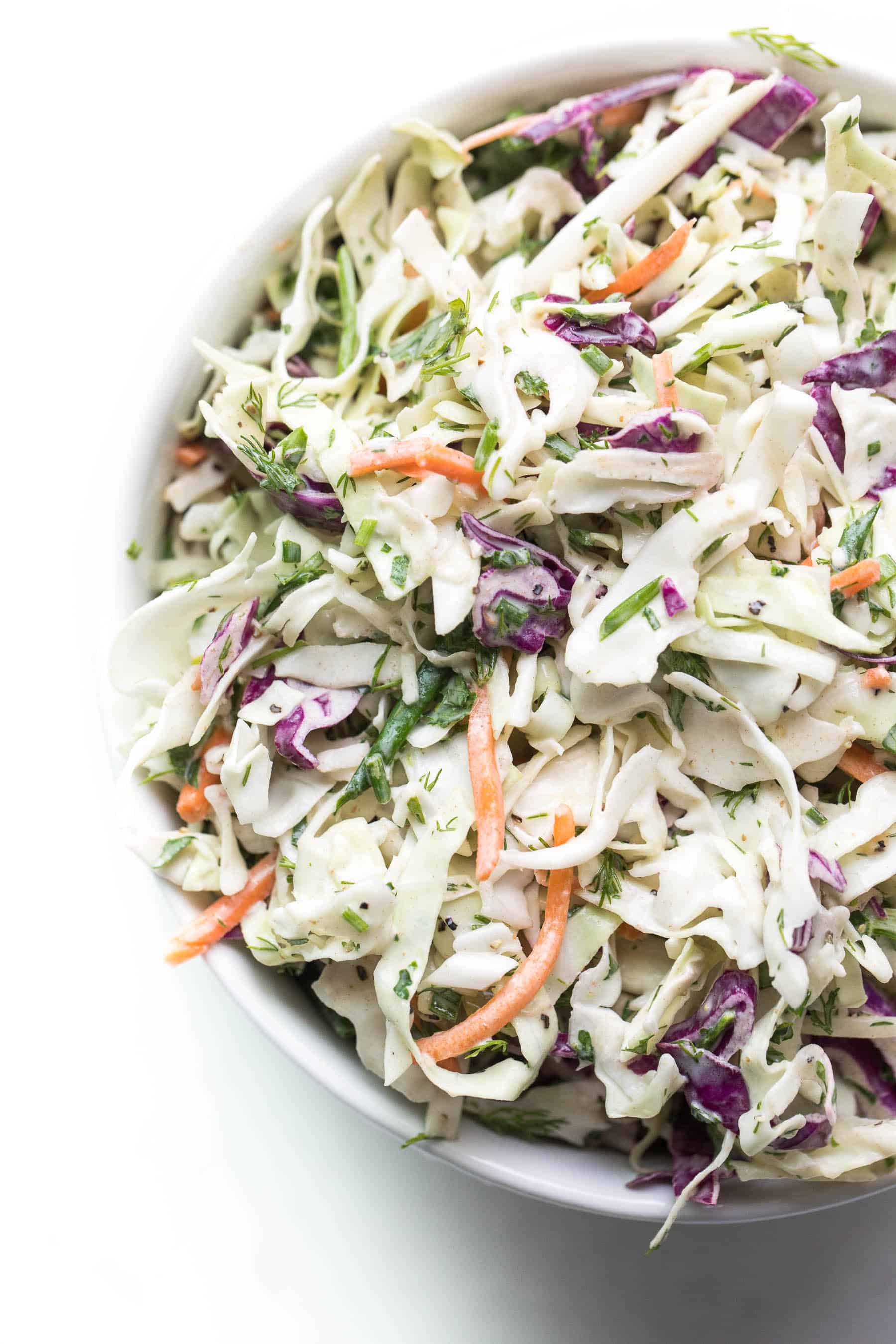 Herby lemon coleslaw in a white bowl