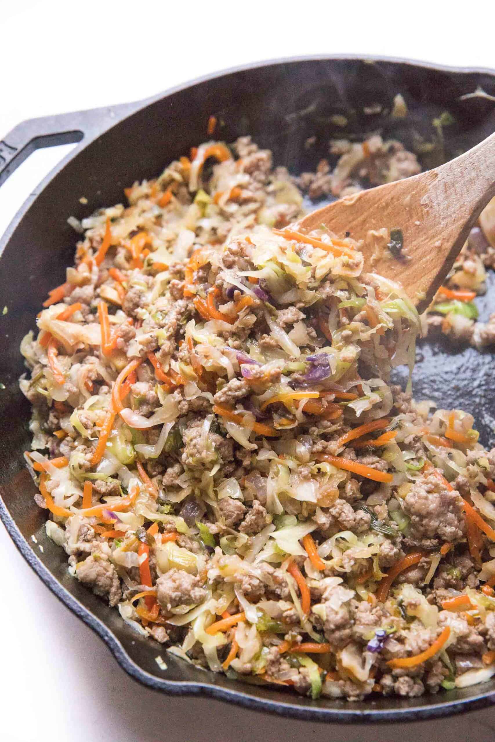 mu shu pork filling in a cast iron skillet